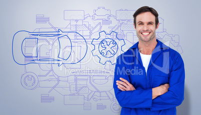 Composite image of happy mechanic with arms crossed over white b