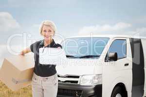 Composite image of happy delivery woman looking for signature