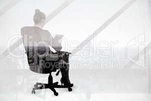 Composite image of businesswoman sitting on swivel chair with ta