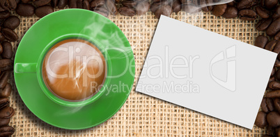 Composite image of green cup of coffee