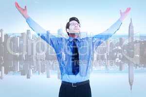 Composite image of cheering businessman with his arms raised up