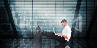 Composite image of businessman with feet up on briefcase