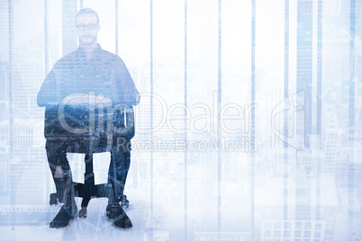 Composite image of stern businessman sitting on an office chair