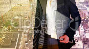 Composite image of businesswoman holding laptop