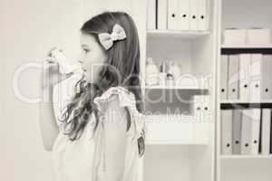 Little girl taking inhaler