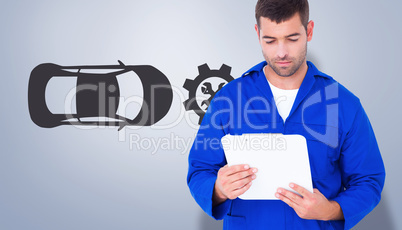 Composite image of mechanic reading clipboard Composite image of mechanic reading clipboard