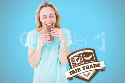 Composite image of happy blonde eating bar of chocolate