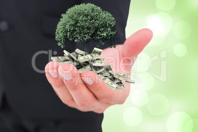 Composite image of businessman holding out his hand