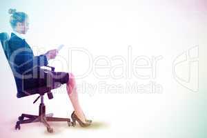 Composite image of businesswoman sitting on swivel chair with ta