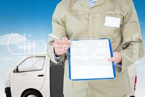 Composite image of delivery man showing blank paper on clipboard