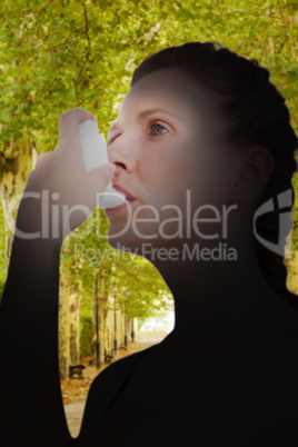 Composite image of woman using inhaler for asthma