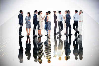 Composite image of many business people standing in a line