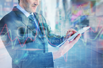 Composite image of mid section of a businessman using digital ta
