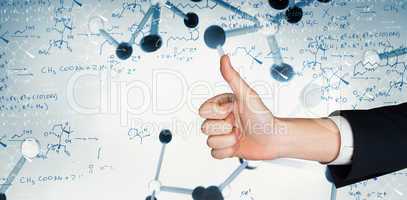 Composite image of hand showing thumbs up