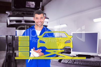 Composite image of smiling mechanic wiping hands with cloth