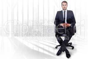 Composite image of stern businessman sitting on an office chair