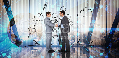 Composite image of businessmen shaking hands