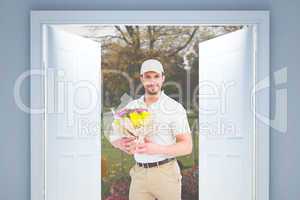 Composite image of delivery man holding bouquet