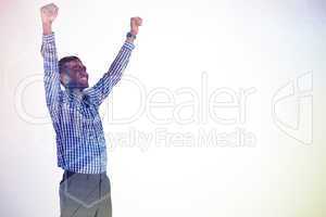 Composite image of excited businessman cheering