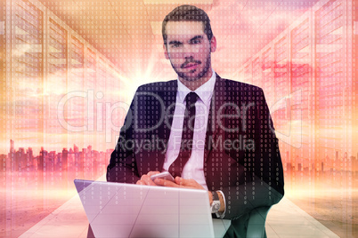 Composite image of cheerful businessman with laptop using smartp