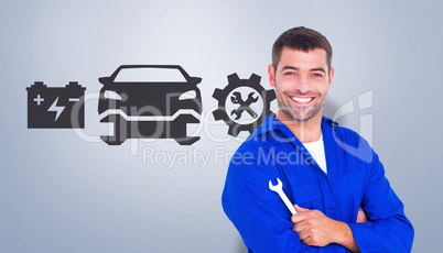 Composite image of happy mechanic holding spanner on white backg