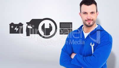 Composite image of happy mechanic holding spanner on white backg