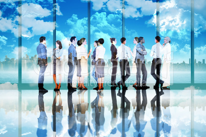 Composite image of many business people standing in a line