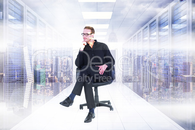 Composite image of thoughtful businessman sitting on a swivel ch