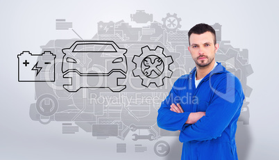 Composite image of mechanic standing arms crossed