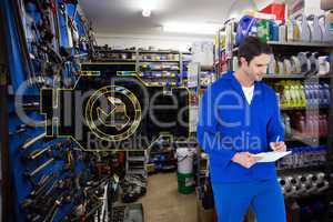Composite image of mechanic writing notes over white background