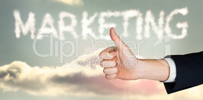 Composite image of hand showing thumbs up