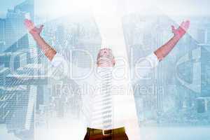 Composite image of handsome businessman cheering with arms up