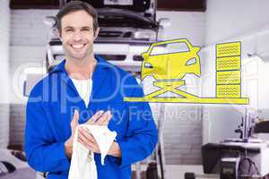 Composite image of confident mechanic wiping hand with napkin