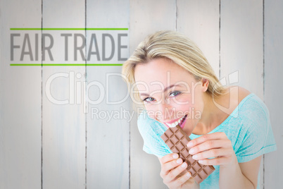 Composite image of pretty blonde eating bar of chocolate