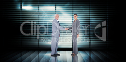 Composite image of business team shaking hands