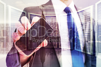 Composite image of businessman showing his smartphone screen