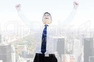Composite image of excited businessman with glasses cheering