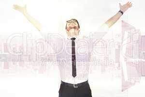 Composite image of cheering businessman with his arms raised up