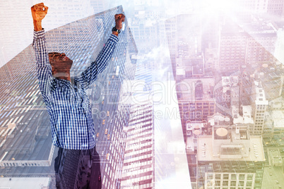 Composite image of excited businessman cheering