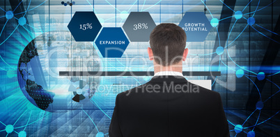 Composite image of  businessman looking in front of him in suit