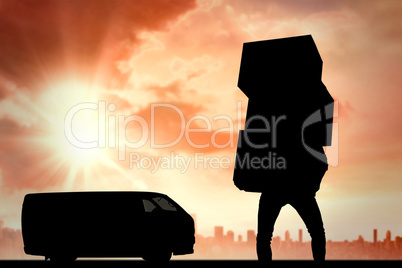 Composite image of man carrying pile of boxes