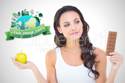 Composite image of pretty brunette deciding between apple and ch