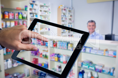 Composite image of man using tablet pc