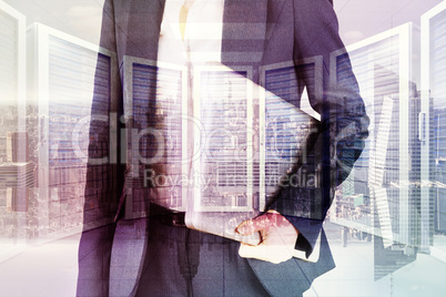 Composite image of businesswoman holding laptop