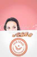 Composite image of pretty brunette peeking at chocolate