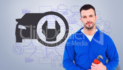 Composite image of smiling male mechanic holding monkey wrench