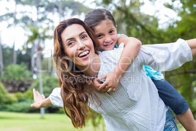 mother and daughter having fun in the park