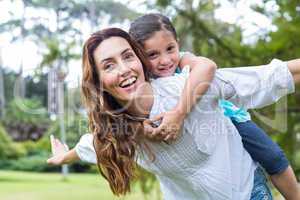 mother and daughter having fun in the park