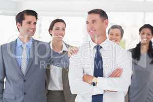 Business people congratulating their colleague