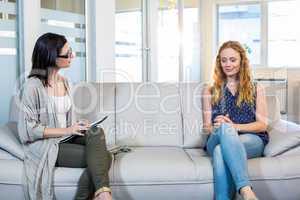 Psychologist talking with happy woman